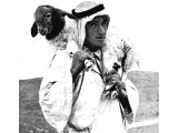 A shepherd carrying a lamb or strayed sheep on his shoulders. An early photograph.